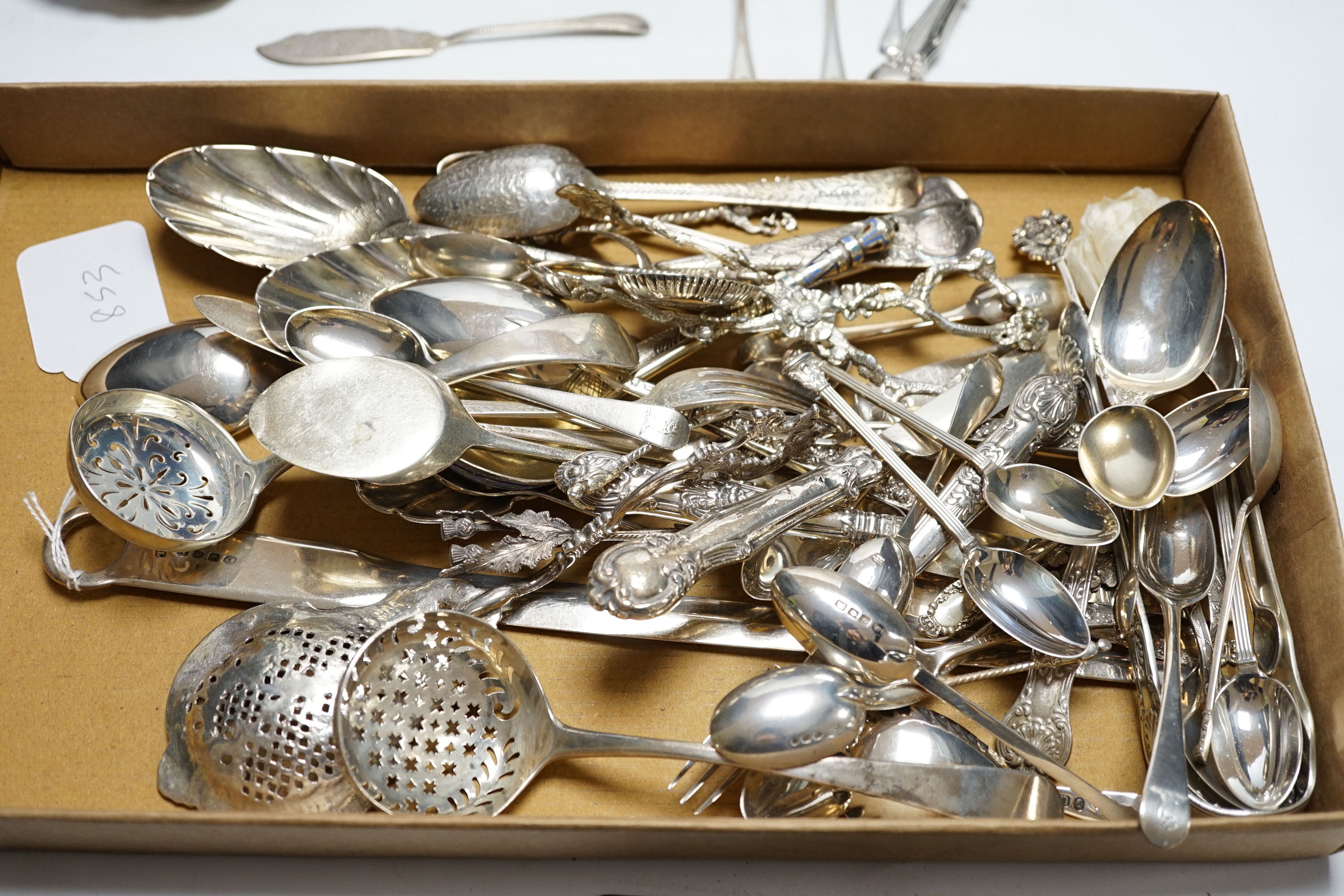 Assorted silver and white metal flatware, including four 18th base mark silver spoons, 20cm, cased coffee spoons and christening pair, rustic sugar tongs, caddy spoons, George III meat skewer and a 19th century Russian 8